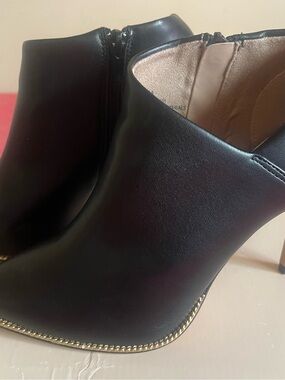 BCBGeneration Black Ankle Booties with Gold Chain Accent